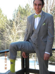 silver suit and lime green socks and tie